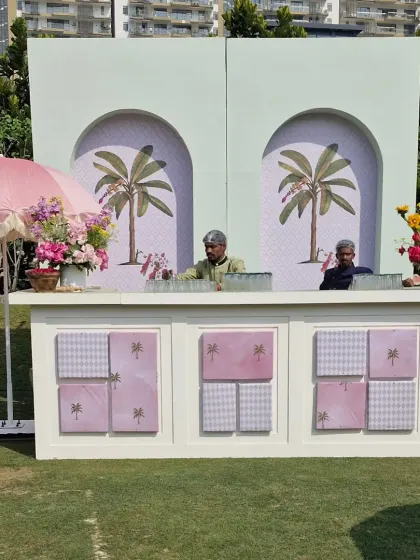 Our custom-built bar for the palm garden event. The design features a mint green arched backdrop with palm motifs and a white paneled front, perfectly matching the chic, relaxed vibe.