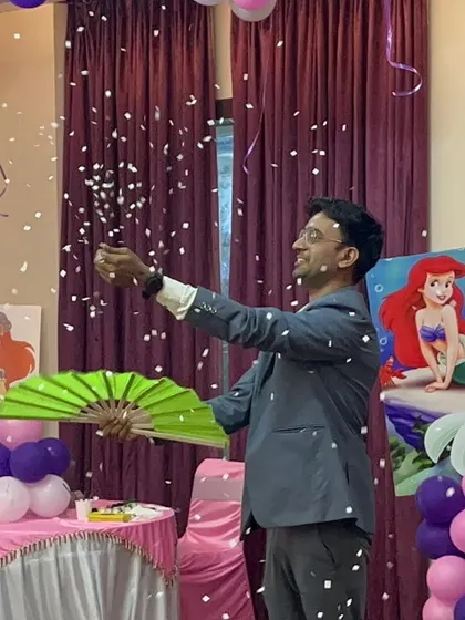 Performing my "snowstorm" illusion at a mermaid-themed birthday party. The falling snow adds a touch of enchantment to the celebration.