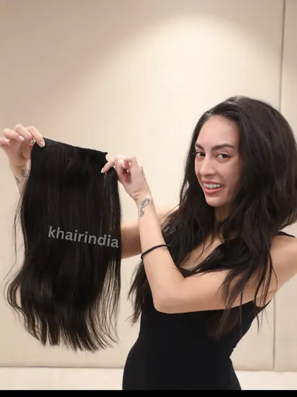 Miss Environment Philippines holding her 18-inch brown extensions before application. We customize the length and color to ensure a perfect, natural-looking match for every client.