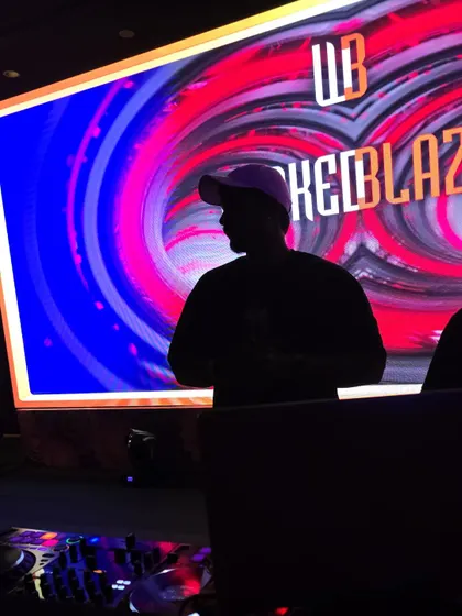 A silhouette shot against a vibrant LED backdrop. Sometimes the visuals are so powerful they become part of the performance.