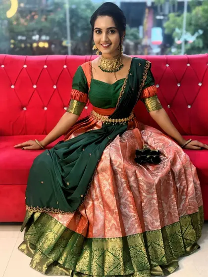 This half saree is perfect for young women attending weddings or celebrating festivals like Varamahalakshmi.