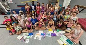 Team supporting team! Our compulsory level teams made cards and goodie bags to wish our Level 7 team good luck at their State meet. This is what our community is all about.