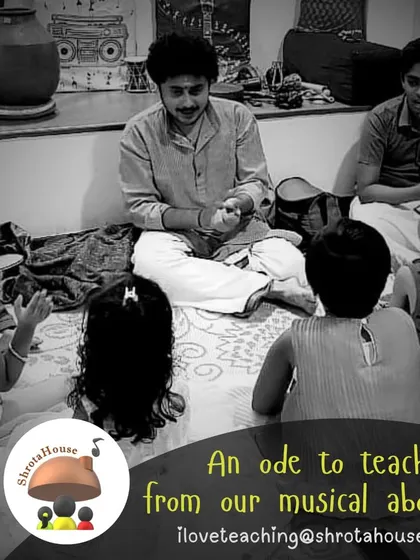An instructor surrounded by curious children, all eager to learn and participate. Our workshops are a playground of sound and rhythm.