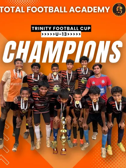 Our U13 team celebrating their championship win at the Trinity Football Cup.