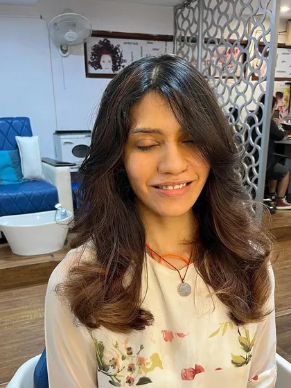 Butterfly layers for Shruti that are designed to work whether she wears her hair curly or straight.