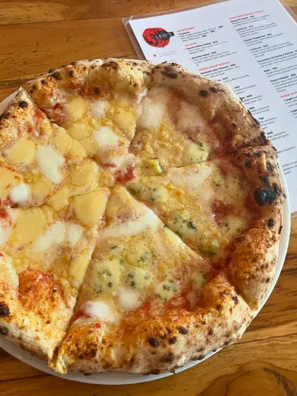 Our Four Cheese pizza, a must-try for anyone who loves cheese.