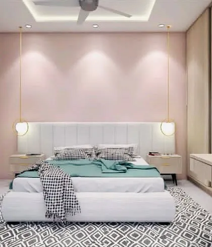 A chic bedroom concept with a soft pink accent wall and a stylish patterned rug. The hanging pendant lights on either side of the bed add a modern, decorative touch.