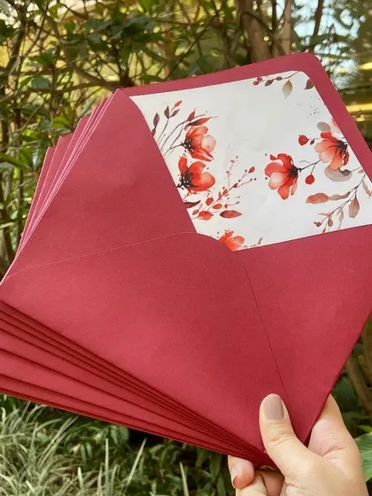 A closer look at the details from this beautiful wedding suite. The design included multiple inserts with event details, custom floral envelope liners, and a personalized wax seal with the couple's initials.