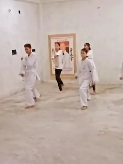 The class is practicing basic punches. The goal is to make every punch sharp and powerful.