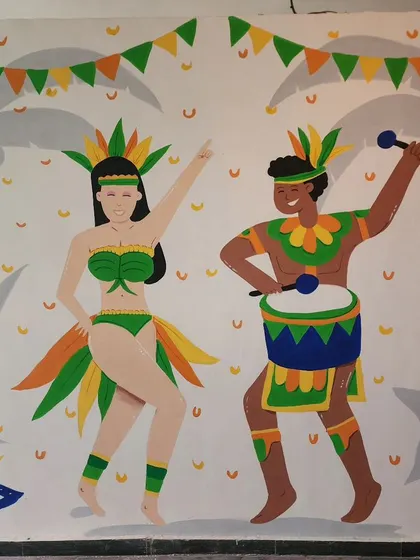 A close-up of the carnival dancers mural at Cirkus, featuring vibrant characters in festive costumes, complete with drums and maracas.