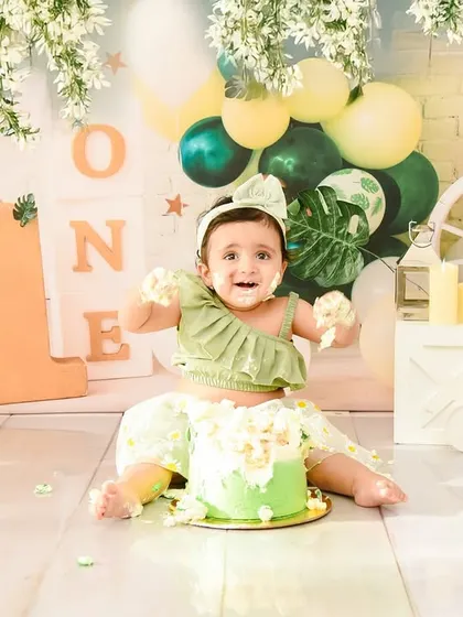 The cake smash is a success! Her happy, messy face is a perfect memory from her first birthday celebration in the studio.