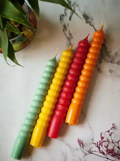 A clean, simple shot of the ribbed texture on my Taper Candles. They are designed for a minimal-drip, 6-hour burn, making them both beautiful and practical for dinners and events.