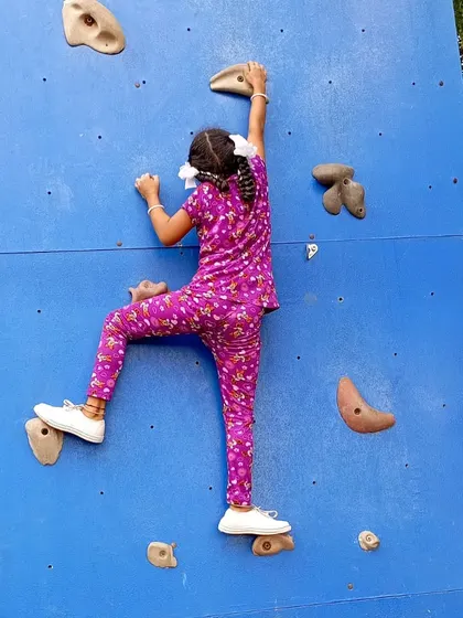 It's never too early to start climbing. A young girl scales our Davangere climbing wall during a free session for local enthusiasts.