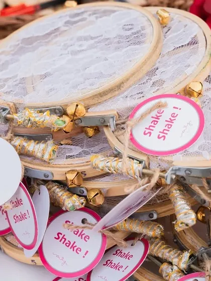 Custom-made wedding favors, these tambourines with the tag "Shake Shake!" are a fun way for guests to celebrate the couple.