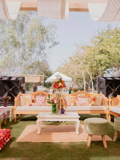 A wide shot of a lounge area at the 'Rajasthani Folklore' Mehendi, showing how we mix and match furniture and textiles to create an eclectic, curated look.