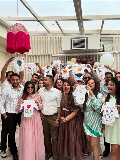 A baby shower with a creative twist! Friends and family came together to paint these adorable custom onesies, creating personal and heartfelt gifts for the baby-to-be. It's a wonderful way to make lasting memories.