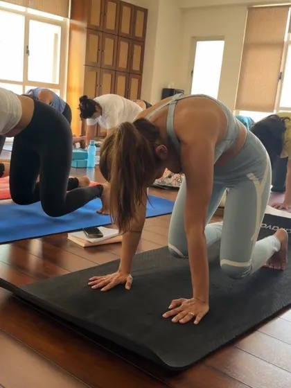 The cat-cow stretch is a fundamental part of our warm-ups, gently awakening the spine and connecting us to our breath.