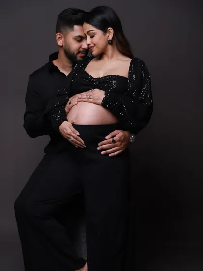 The quiet moments are often the most powerful. Here, we focused on the intimate connection between the parents-to-be in a modern, chic studio setting. It’s a simple pose that speaks volumes about their shared anticipation and love.