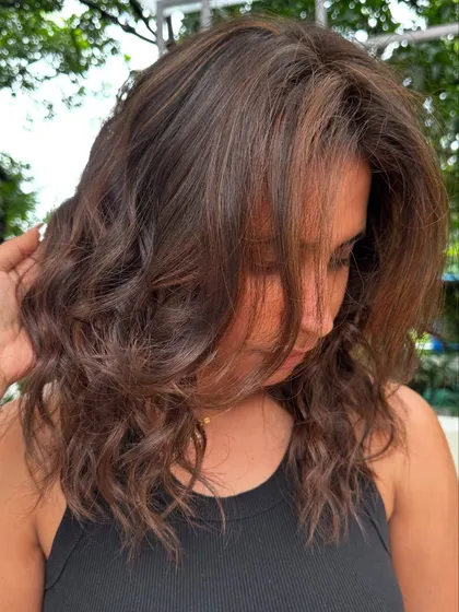 A candid shot of her loving her new holiday hair.