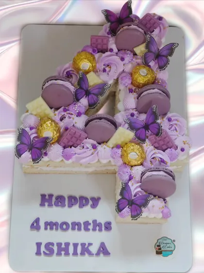A number '4' monogram cake to celebrate a baby's 4-month milestone. The purple theme with butterflies and Ferrero Rocher makes it extra special.