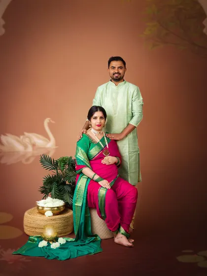 A beautiful portrait of a couple in traditional attire against a fine-art backdrop. The image evokes a sense of serenity and timeless elegance.