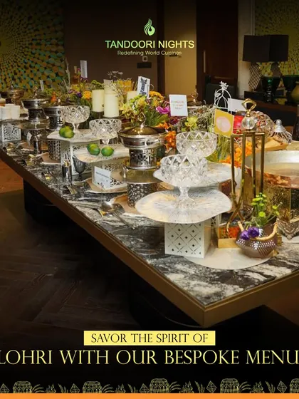 Savor the spirit of Lohri with our bespoke menu. This image shows a beautiful table setup for a Lohri celebration, showcasing our ability to cater for both grand events and cozy gatherings.