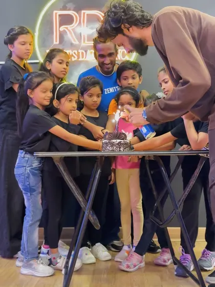 The instructors are just big kids at heart. Here is our team lighting the cake during the Children's Day celebration, surrounded by our excited students.