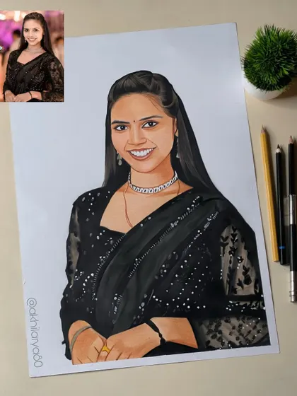 A smiling woman in a black saree, drawn on A3 paper with colored pencils. The intricate silver necklace was a key detail I focused on to make the portrait special.