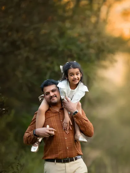 Nothing beats a shoulder ride from dad! This is pure happiness. These are the fun, candid moments that kids will look back on and smile about for years to come.
