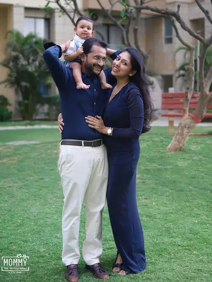The best seat in the house! A playful moment during an outdoor family session, with the little boy sitting happily on his dad's shoulders.
