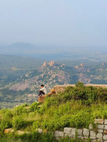 A moment of solitude, overlooking the vast expanse of hills and valleys. A perfect escape from the city noise.