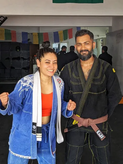 Posing with a student after a tough gi training session. I believe that we build strength through adversity and that our weaknesses, when confronted, become our greatest assets. This philosophy is at the heart of our team.