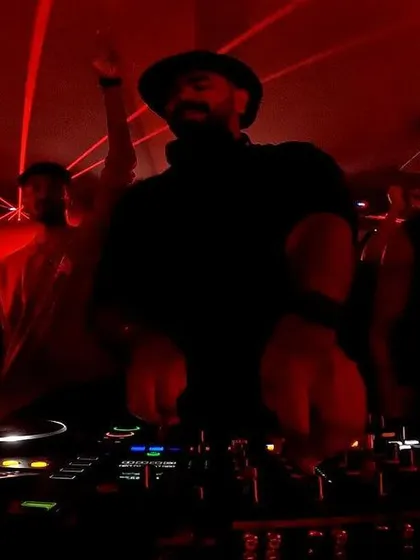 Another view from the boiler room, with red lasers cutting through the dark club. This captures the raw, underground feel of the event.
