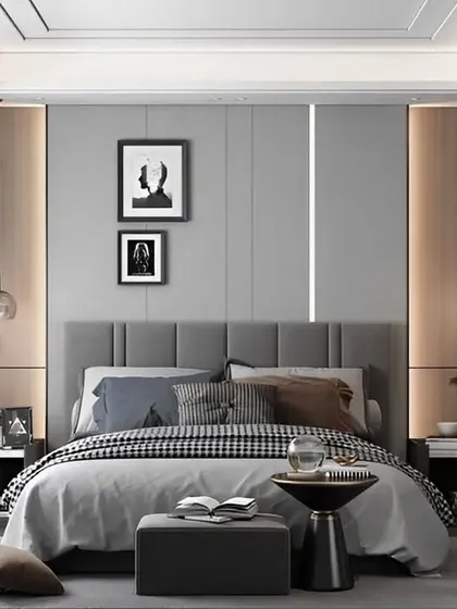 A sophisticated bedroom in shades of grey and beige, with elegant pendant lights and integrated wall lighting. The glass wardrobe adds a touch of modern sleekness.