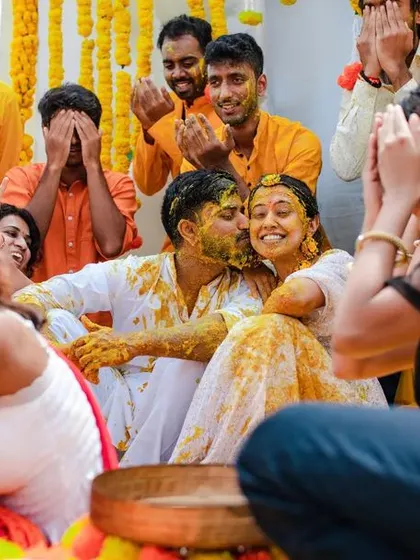 A duplicate of 46, capturing the candid reactions and laughter of guests during the Haldi.