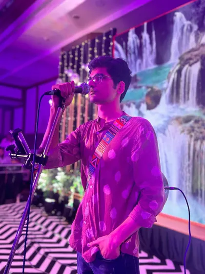 A moment of focus during a live show. The stage lights, the music, the crowd, it all comes together. This was taken during a performance at a large wedding event.