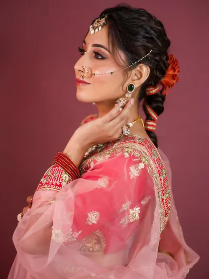 A side profile showing the beautiful braided hairstyle, a popular choice for lehenga looks.