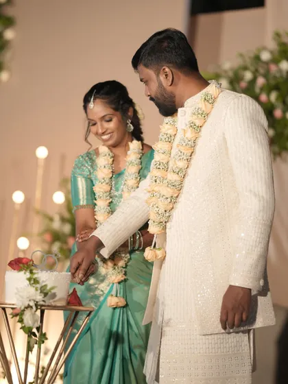 The cake cutting ceremony is a sweet highlight of the reception. I ensure this moment is beautifully staged, with the couple framed by the elegant decor and lighting.