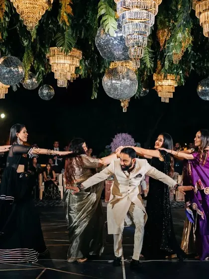 A fun, train-like formation with the groom and his friends. It's a great way to get everyone involved.