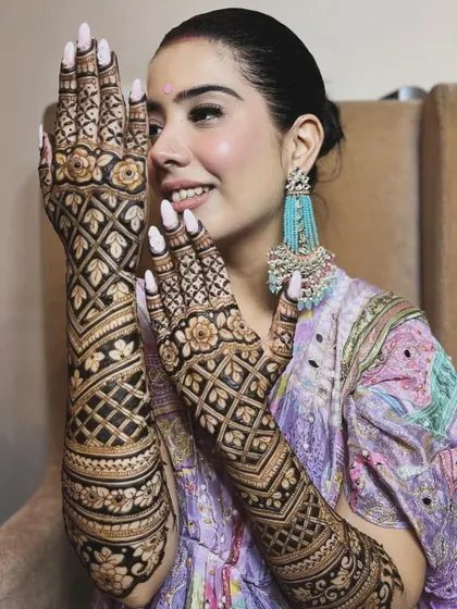 A happy client ready for Rakhi celebrations. Her full-hand jaal (net) pattern is a classic choice that always looks elegant and festive.