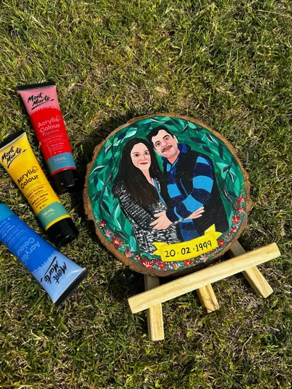 The final look of a custom portrait illustration on a 6-inch wood slice, complete with a wooden easel stand. A perfect anniversary gift!