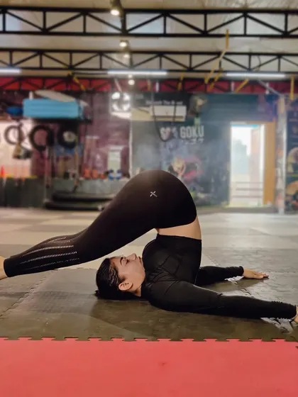 The plow pose (Halasana) provides a deep stretch for the back and shoulders. It's a key part of our mobility work to counteract the effects of intense training.