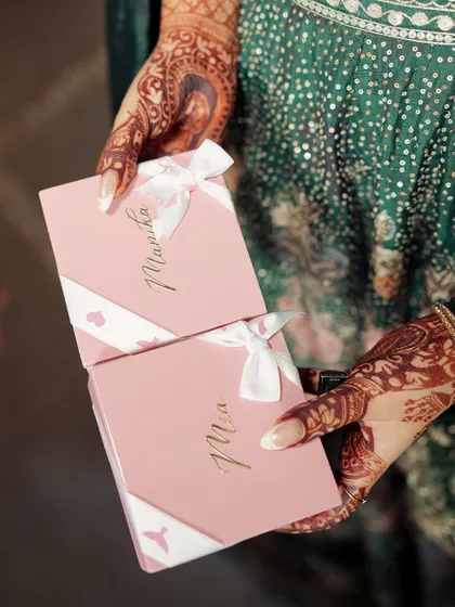 Little personalized gifts for the bridesmaids, tied with a ribbon. It's a small token of appreciation for the friends who stand by you on your big day.