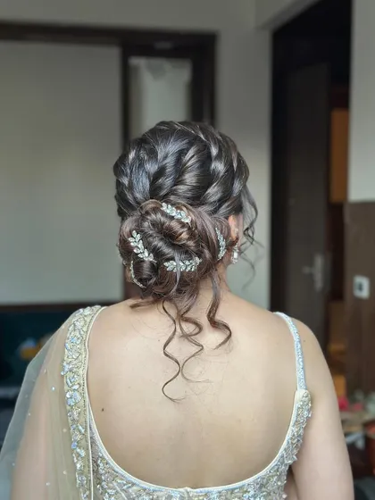 A close-up of the braided detail within the messy bun, showcasing the craftsmanship.
