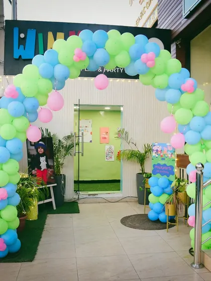 Another angle of the welcoming balloon arch, showing how I transform the entrance to match the party's theme.
