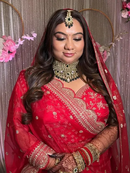 This image showcases the full bridal look. The makeup is flawless and designed to last, ensuring the bride looks perfect from every angle and in every photo.