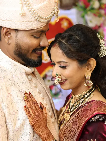 A beautiful, intimate moment between our Maharashtrian bride and groom. Her makeup is soft and romantic, with a classic winged liner and a traditional nath.