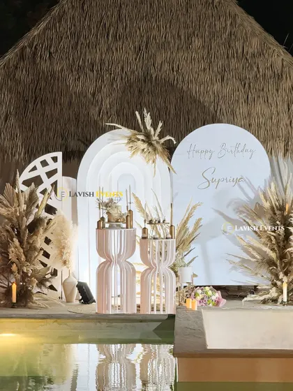 This is my signature boho chic style, perfect for an elegant poolside birthday. I use earthy tones, pampas grass, and custom-designed props to create a vibe that is both relaxed and incredibly stylish.