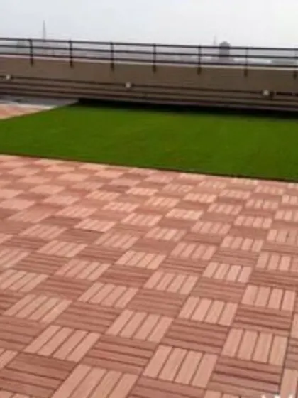 I also install durable WPC (Wood Plastic Composite) deck tiles. They are a great, weather-resistant alternative to real wood and pair perfectly with artificial grass on rooftops and balconies.