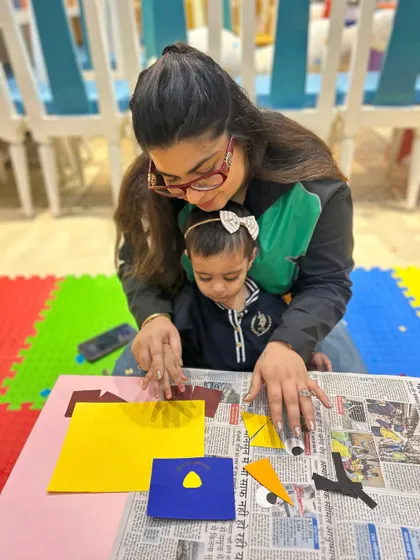 A mother and daughter at our Rajouri Garden center work on a paper craft, showcasing the focused, one-on-one time our classes provide.
